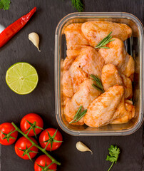 Fresh Chicken wings in sauce, grill and barbecue marinade. Top view of chicken wings recipe
