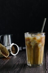 Milk poured into iced coffee 