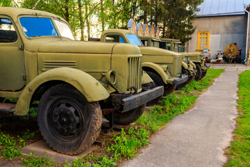 Rusty soviet retro trucks in Open air Museum of Folk Architecture and Folkways of Middle...