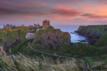 Ruins of Dunottar castle on a cliff, on the north east coast of Scotland, Stonehaven, Aberdeen, United Kingdom - obrazy, fototapety, plakaty