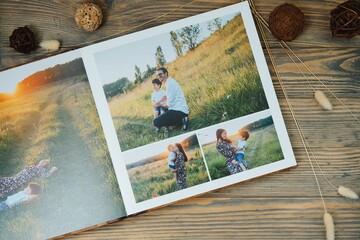 Luxury wooden photo book on natural background. Family memories photobook. Save your summer...