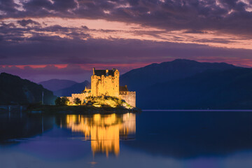 Naklejka na ściany i meble Nigh-time at Eilean Donan castle at Kyle of Lochalsh in the Scottish highlands