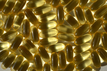 many omega 3 capsules close up background