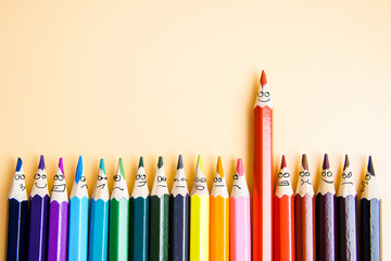 Colorful pencils as the emotions of the faces of isolated people. The concept of success.