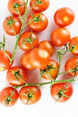 Top view shot, vine cherry tomatoes on a light background