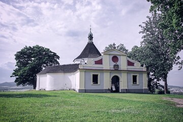 A view to the Chapel of the Exaltation of the Holy Cross at the top of the hill above Cesky Krumlov, Czech republic