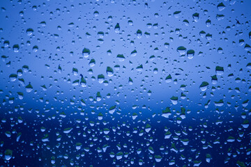 Blue water drops on a window