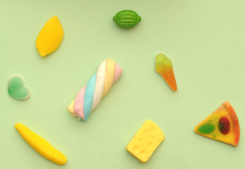 Delicious colorful jelly candy on background