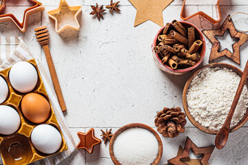 Christmas baking concept. Ingredients for christmas cookies on gray tiles background, copy space.