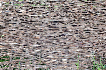 straw fence, dry straw horizontally, background or texture