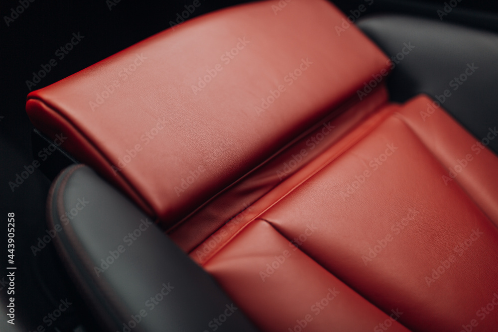 Wall mural Red leather car seats in the expensive sport car