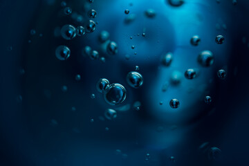 Abstract background of dark blue color bubbles in liquid. 