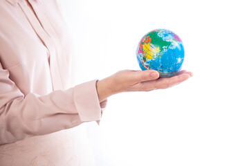 woman holds planet earth in her hand on a white background, isolate