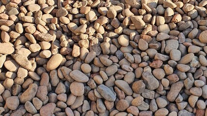 Small stones texture and  background. Rounded river stones.