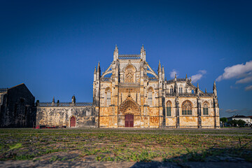 Fototapeta premium Batalha - June 22, 2021: The Majestic Batalha Monastery, Portugal