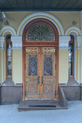 wooden door with a beautiful decorative metal finish in the capital of Tatarstan - Kazan, Russia