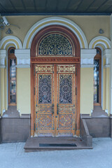 Obraz premium wooden door with a beautiful decorative metal finish in the capital of Tatarstan - Kazan, Russia