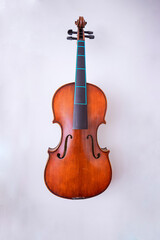 Fototapeta na wymiar Violin in the luthier's workshop wall 