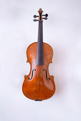 Fototapeta na wymiar Violin in the luthier's workshop wall 