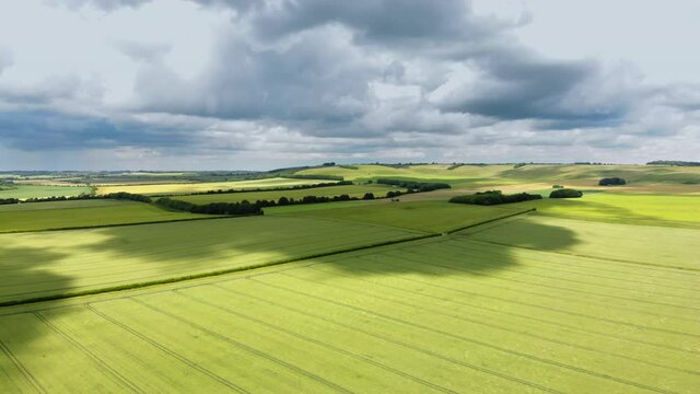 Aerial drone shot of green countryside landscape in Wiltshire, England