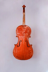 Violin in the luthier's workshop wall 