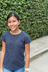 Portrait of a teenage girl smiling outdoors