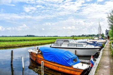 View of the boats and the beautiful landscape of Blokzijl.  Blokzijl, Overijssel, Netherlands, Holland, Europe.