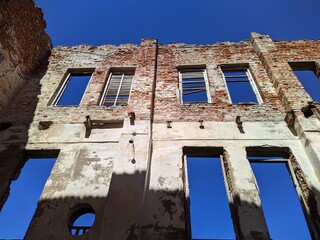 old and ruined building in the daytime in summer.