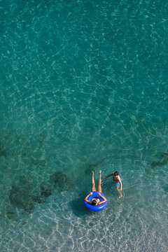 Top view of people having fun and bathing in the mediterranean sea