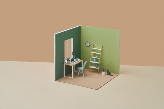 Papercraft black cat near potted plant in room