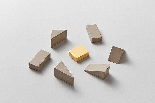 Yellow and gray erasers scattered on background