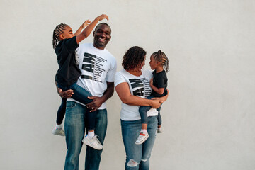 Loving family man with wife and daughters