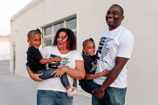 Happy Black family in t-shirts