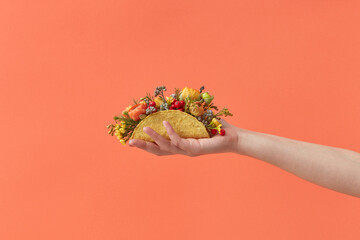 Taco with flowers in hand