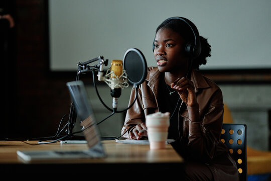 Woman sharing with her thoughts during podcast 