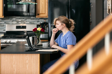 Home: Nurse Works Remotely From Home On Telehealth Visits