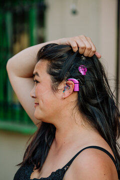 Woman pulls hair from cochlear implant 