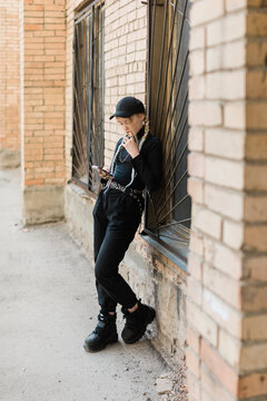 portrait of teen girl on the street with cell-phone