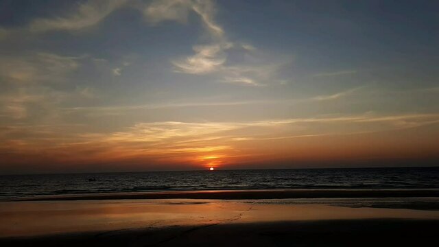 Silhouette of beautiful sunset on the Goa beach and travel in holiday relax time as summer, sunset in the tropical ocean. sunset in goa beach.