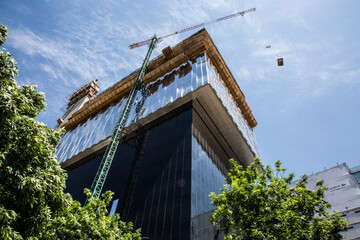 Apartment building constructions, with big crane in motion