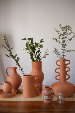Still life shot of terracotta pots on the table