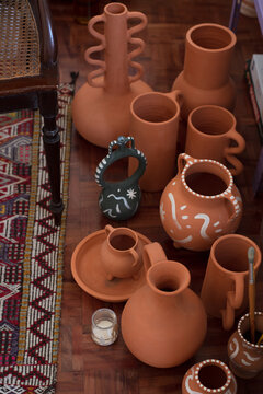 Terracotta pots on the floor in the home studio