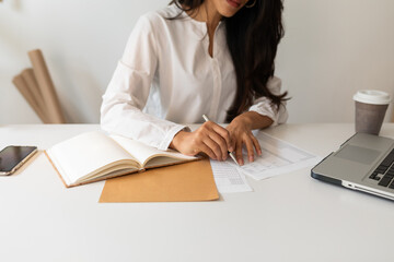Female body part working at office
