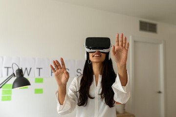 Brunette woman using virtual reality glasses