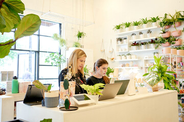 Shop workers on computer