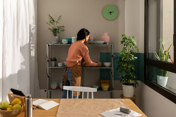 Young enterprising woman working at online store 