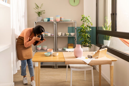 Woman taking a photo at workplace