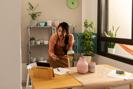 Worker Preparing Online Order Of Ecological Tableware To Send It