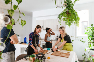 Friends cooking together
