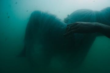 Pregnant Woman Suspended in water